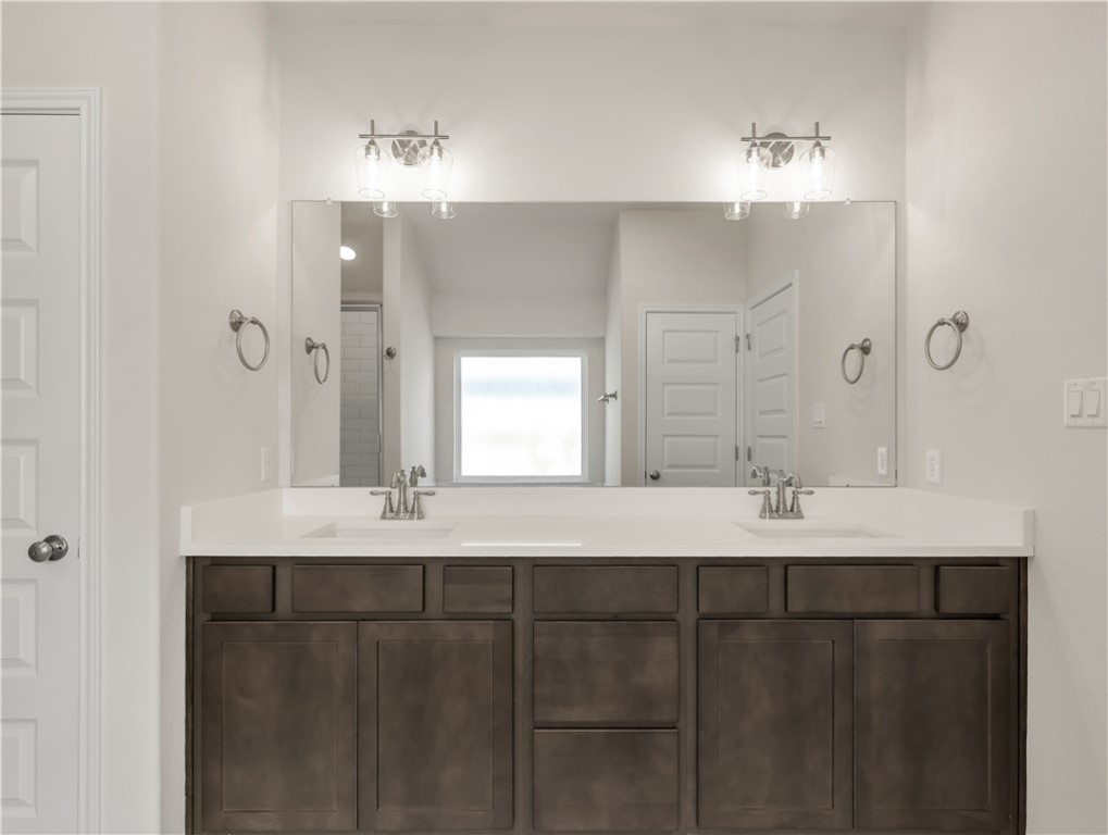 1931 Pinemont View Drive Bryan, TX 77807 - Photo 26 of 43 a bathroom with a sink and a mirror