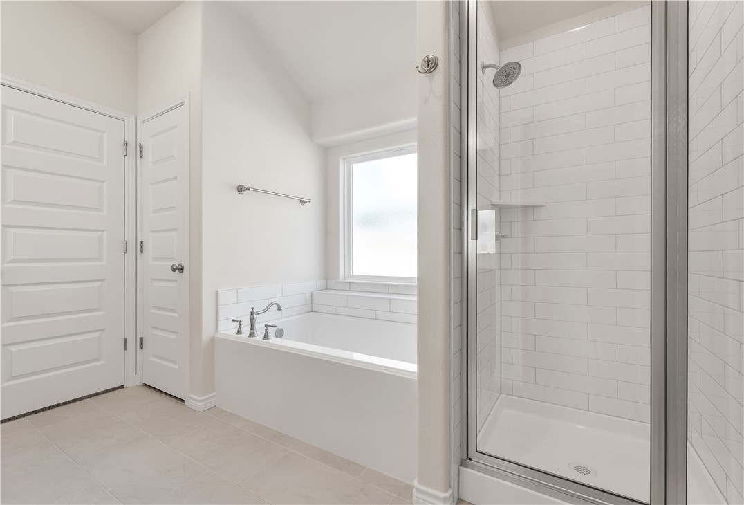 1931 Pinemont View Drive Bryan, TX 77807 - Photo 28 of 43 a bathroom with a bathtub and a shower