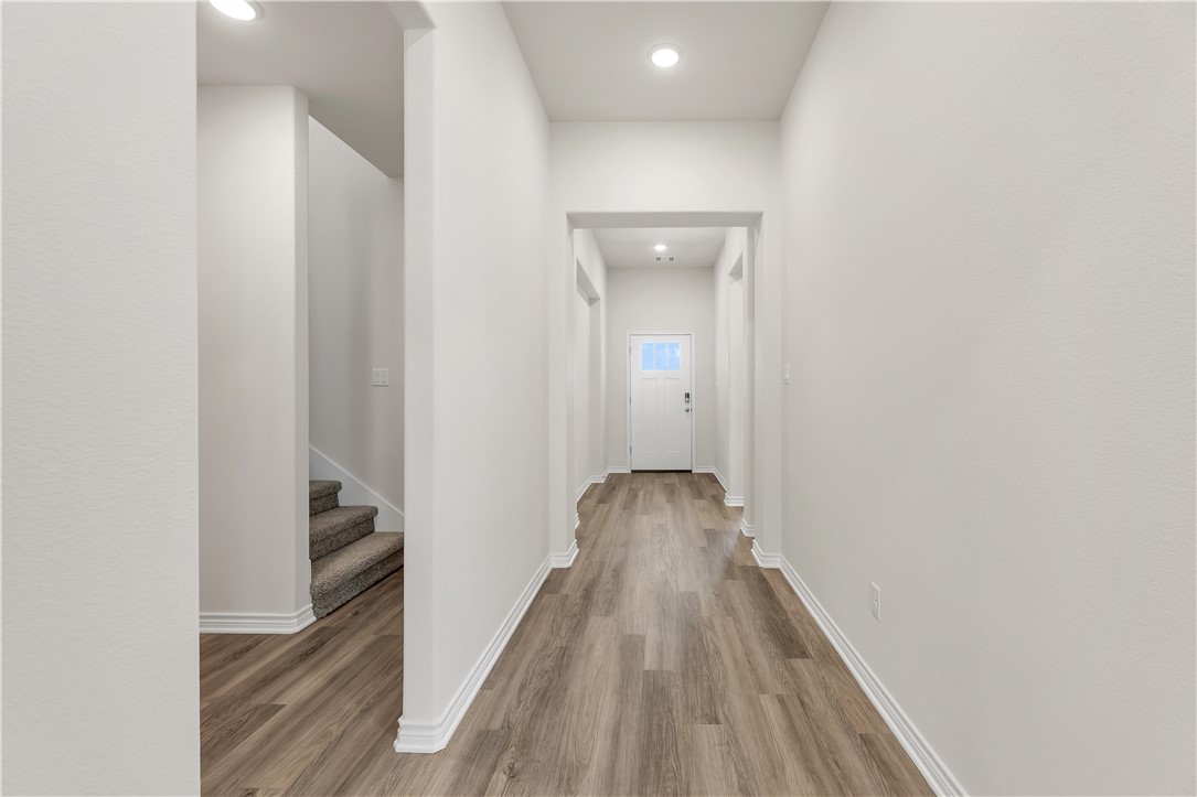1931 Pinemont View Drive Bryan, TX 77807 - Photo 30 of 43 a view of a hallway with wooden floor