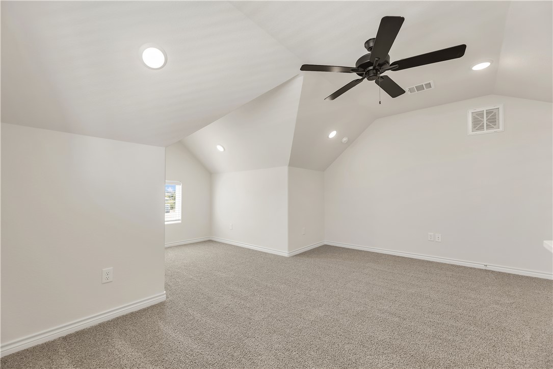 1931 Pinemont View Drive Bryan, TX 77807 - Photo 33 of 43 an empty room with a ceiling fan and a window