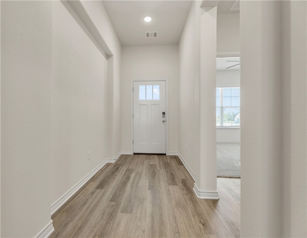 1931 Pinemont View Drive Bryan, TX 77807 - Photo 35 of 43 a view of a hallway with wooden floor