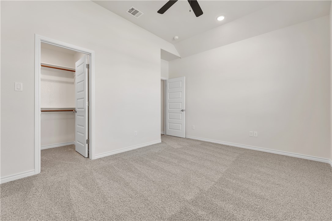 1931 Pinemont View Drive Bryan, TX 77807 - Photo 37 of 43 an empty room with closet and windows