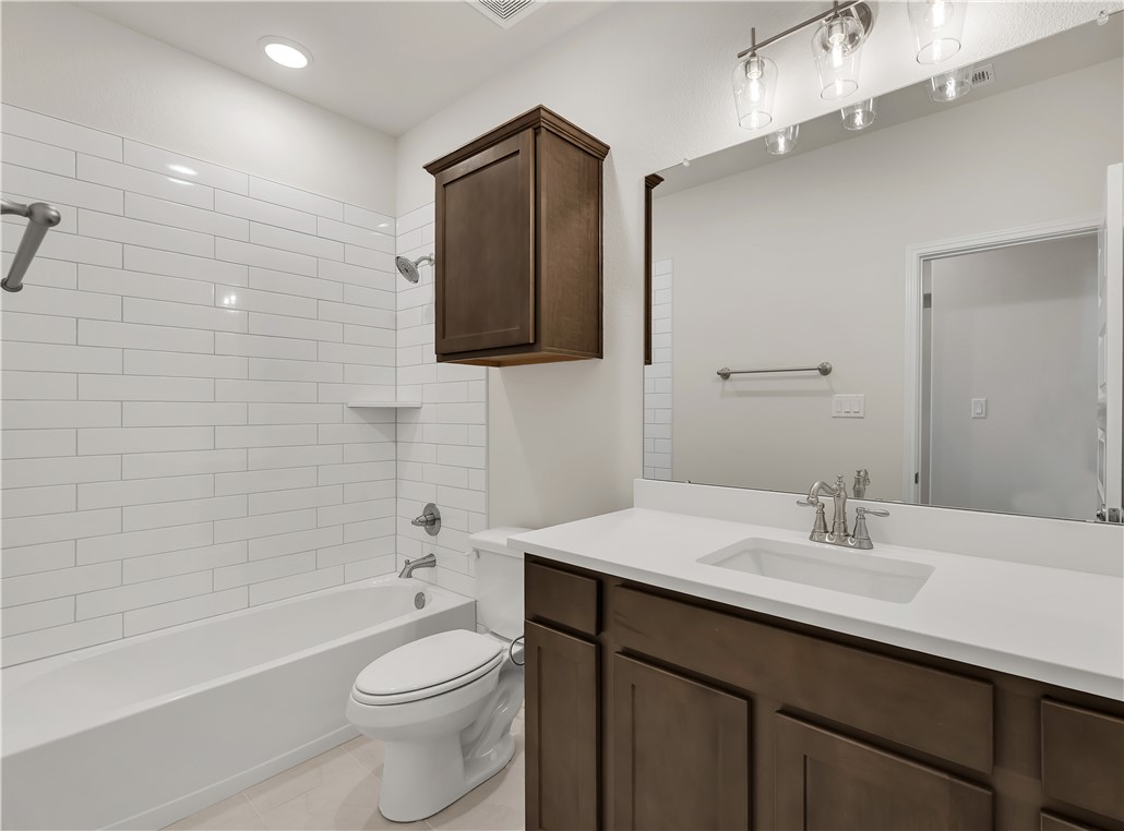 1931 Pinemont View Drive Bryan, TX 77807 - Photo 38 of 43 a bathroom with a sink a toilet and shower