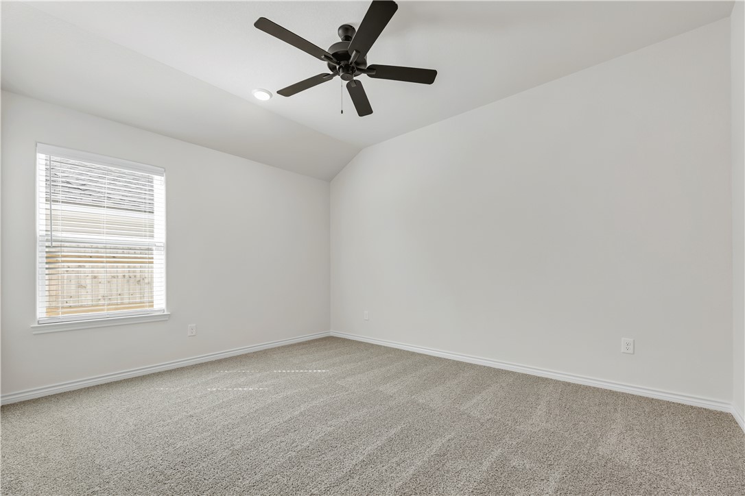 1931 Pinemont View Drive Bryan, TX 77807 - Photo 39 of 43 an empty room with a window and a fan