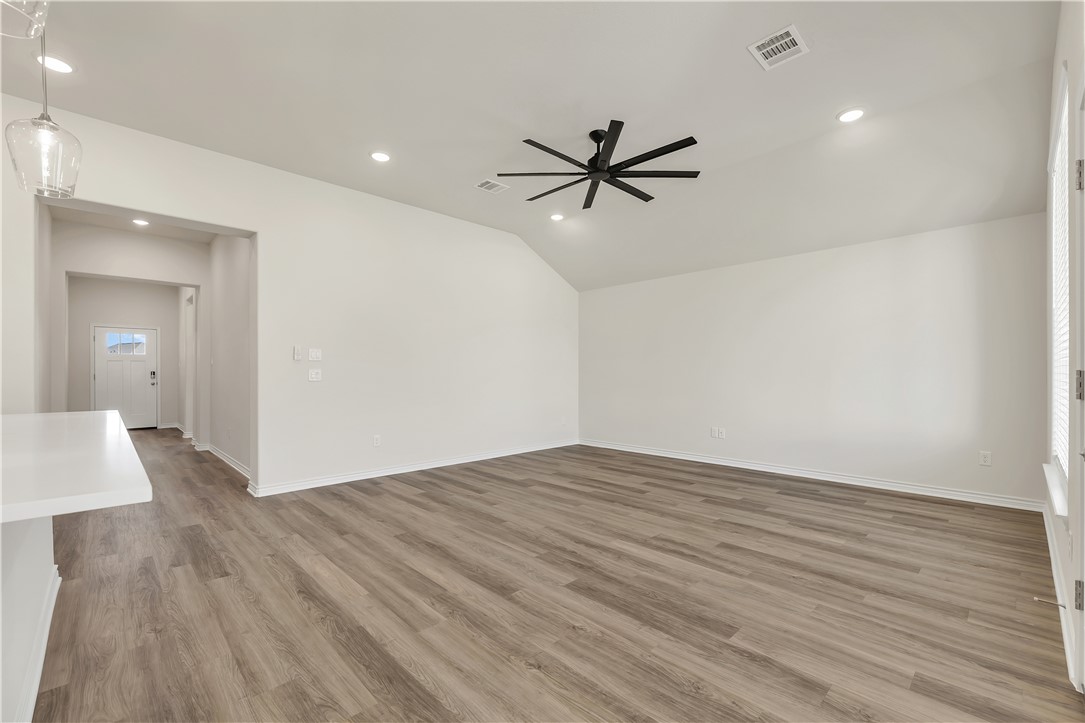 1931 Pinemont View Drive Bryan, TX 77807 - Photo 7 of 43 a view of empty room with wooden floor and ceiling fan