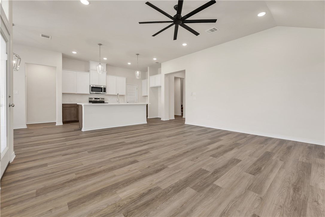 1931 Pinemont View Drive Bryan, TX 77807 - Photo 10 of 43 a view of a kitchen with a sink and wooden floor