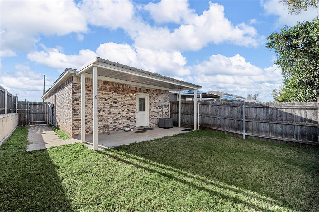 402 Spring Street McGregor, TX 76657 - Photo 15 of 16 a view of a back yard of the house