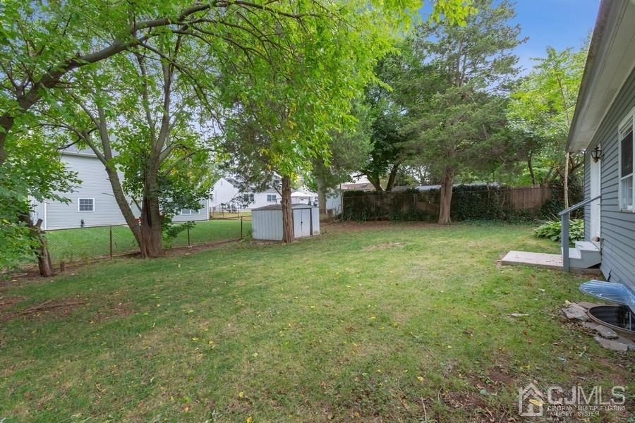 32 Winthrop Road Edison, NJ 08817 - Photo 13 of 15 a view of a backyard with a garden and trees