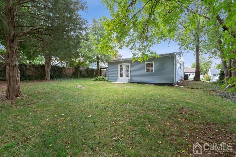 32 Winthrop Road Edison, NJ 08817 - Photo 14 of 15 a front view of a house with yard and tree
