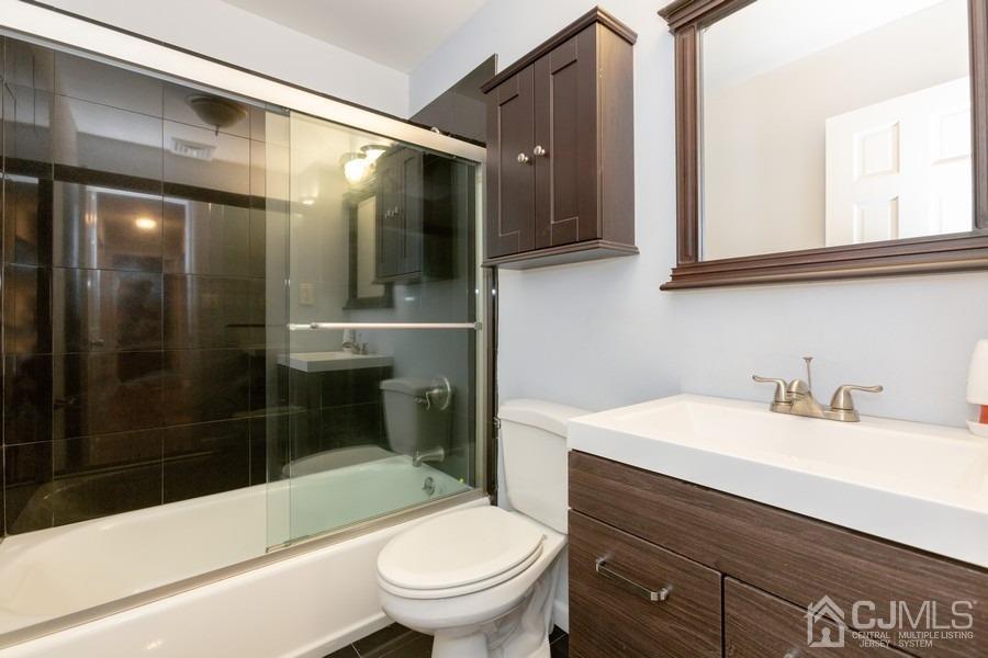 32 Winthrop Road Edison, NJ 08817 - Photo 7 of 15 a bathroom with a sink a toilet and shower