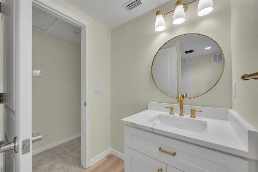 31201 Merry Road Tavares, FL 32778 - Photo 35 of 40 a bathroom with a sink and a mirror