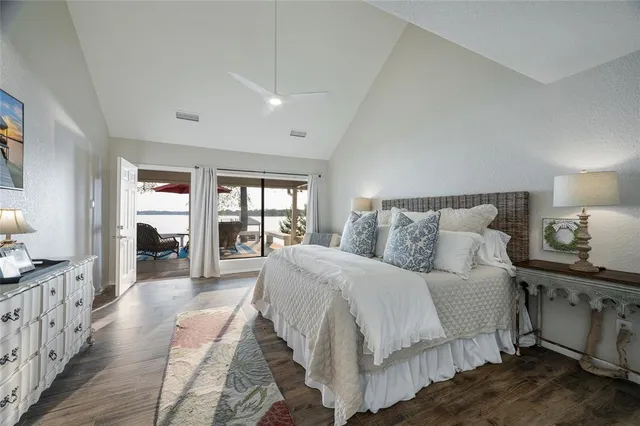 a spacious bedroom with a bed and a large window