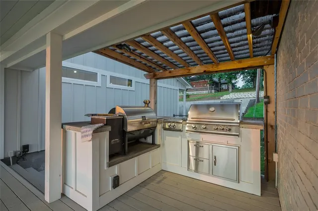 a kitchen with stainless steel appliances granite countertop a stove and a sink