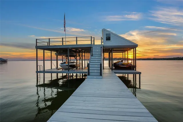 a view of balcony with wooden floor and seating space
