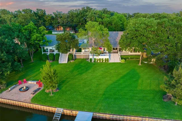 a view of a house with a backyard porch and sitting area