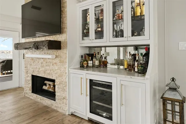 a kitchen with a stove and a white cabinets