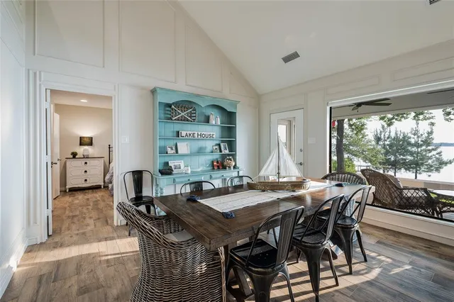 a view of a dining room with furniture and window