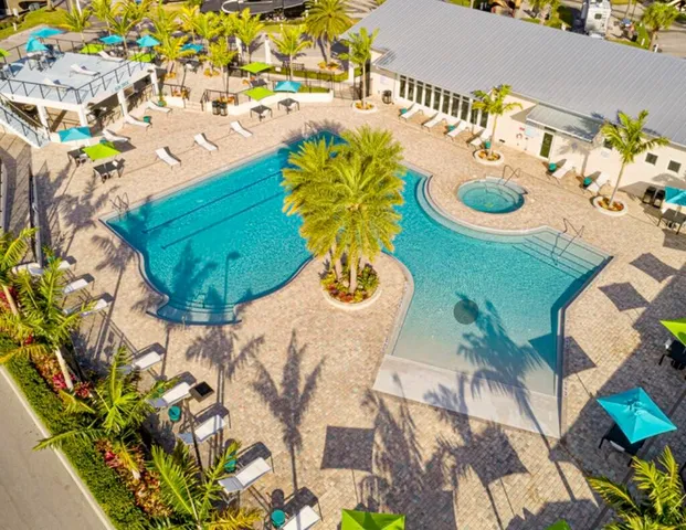 a view of swimming pool with sitting area and slide