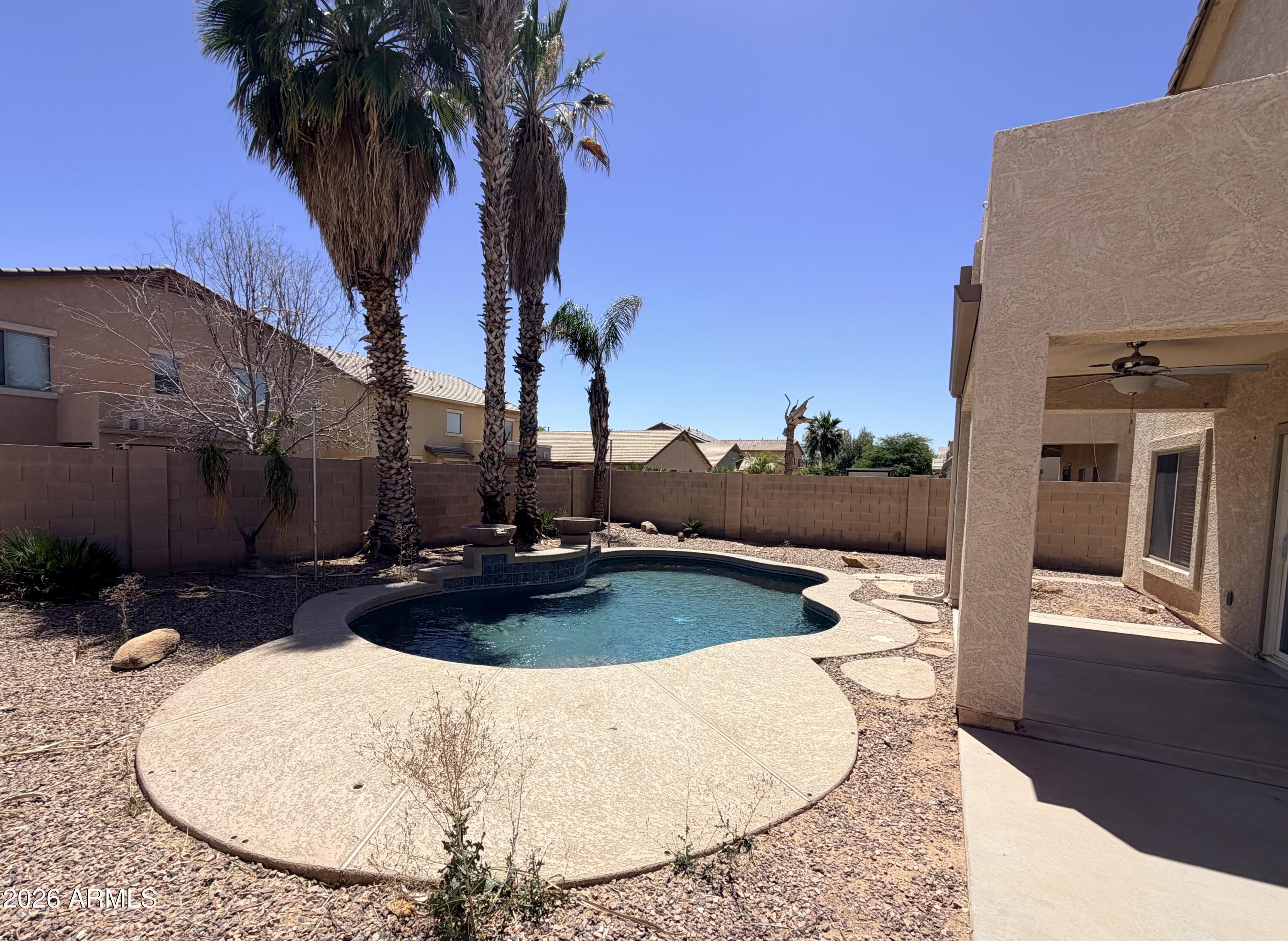 191 West Rio Drive Casa Grande, AZ 85122 - Photo 33 of 34 a view of a swimming pool with lounge chair
