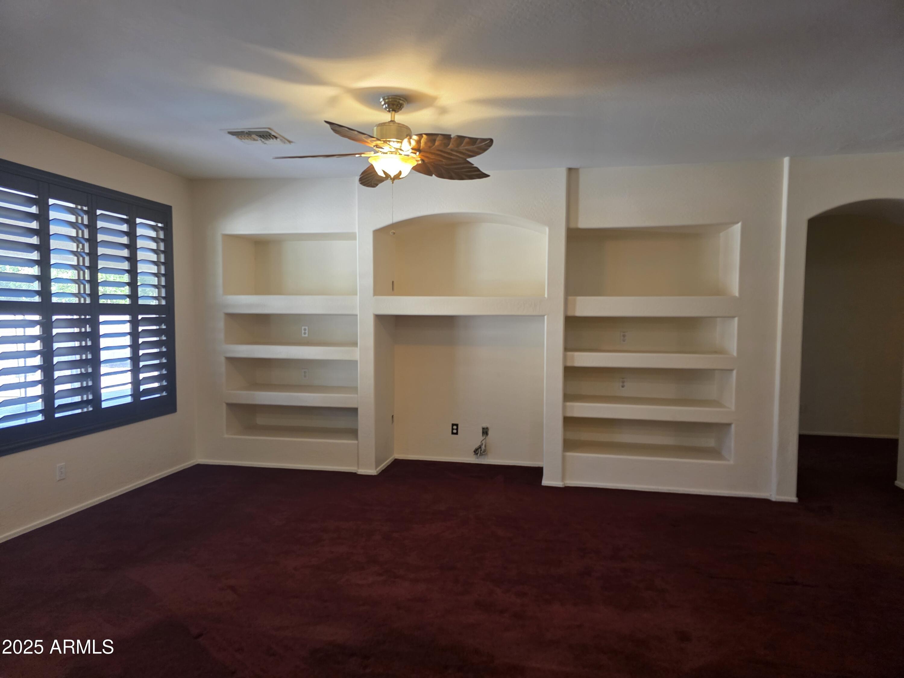 1162 East Springfield Place Chandler, AZ 85286 - Photo 11 of 27 a view of walk in closet with empty racks