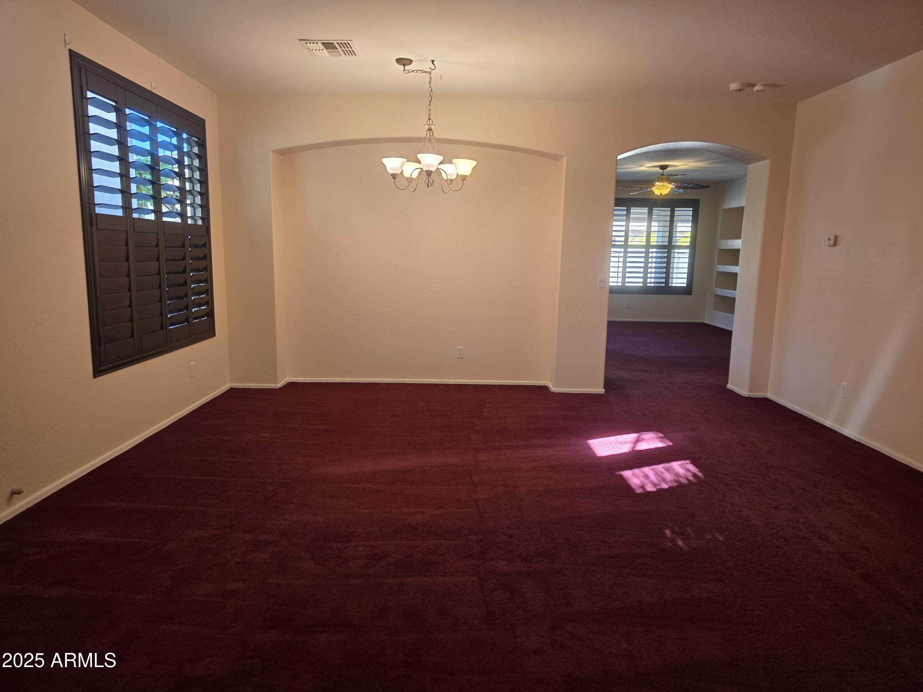 1162 East Springfield Place Chandler, AZ 85286 - Photo 2 of 27 a view of empty room with wooden floor and fan