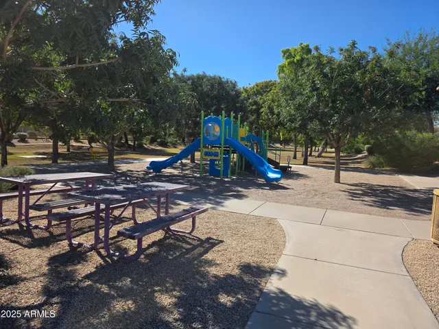 a view of a park with swings and slides