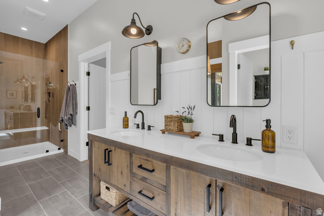 1766 West Tollgate Cyn Road Coalville, UT 84017 - Photo 19 of 59 Double vanity with a white countertop and matte black fixtures