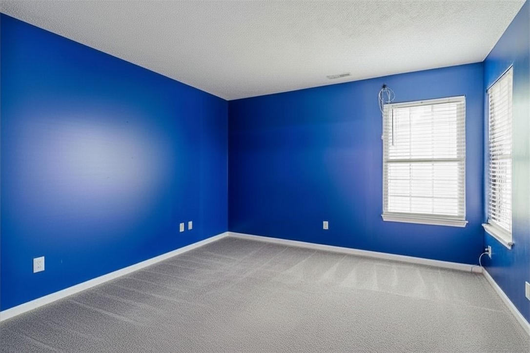 175 Marrett Farm Road Englewood, OH 45322 - Photo 21 of 29 This spacious room features carpeted flooring and ample natural light from multiple windows.