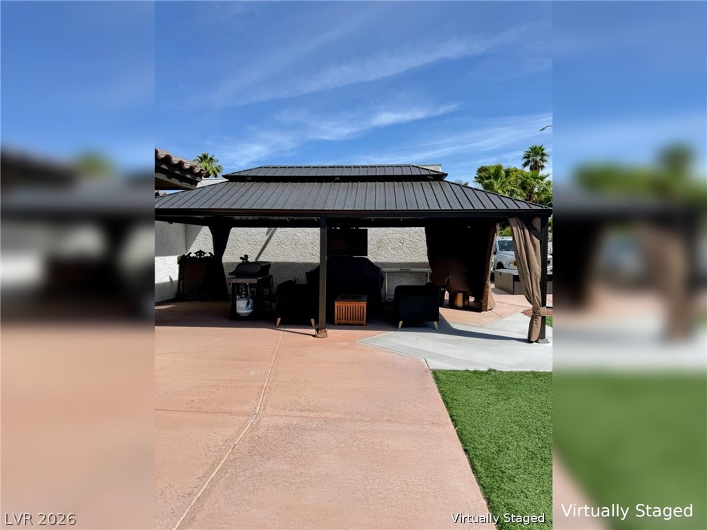 892 North Hollywood Boulevard Las Vegas, NV 89110 - Photo 53 of 81 This private backyard oasis features a covered patio perfect for outdoor entertaining and relaxation.
