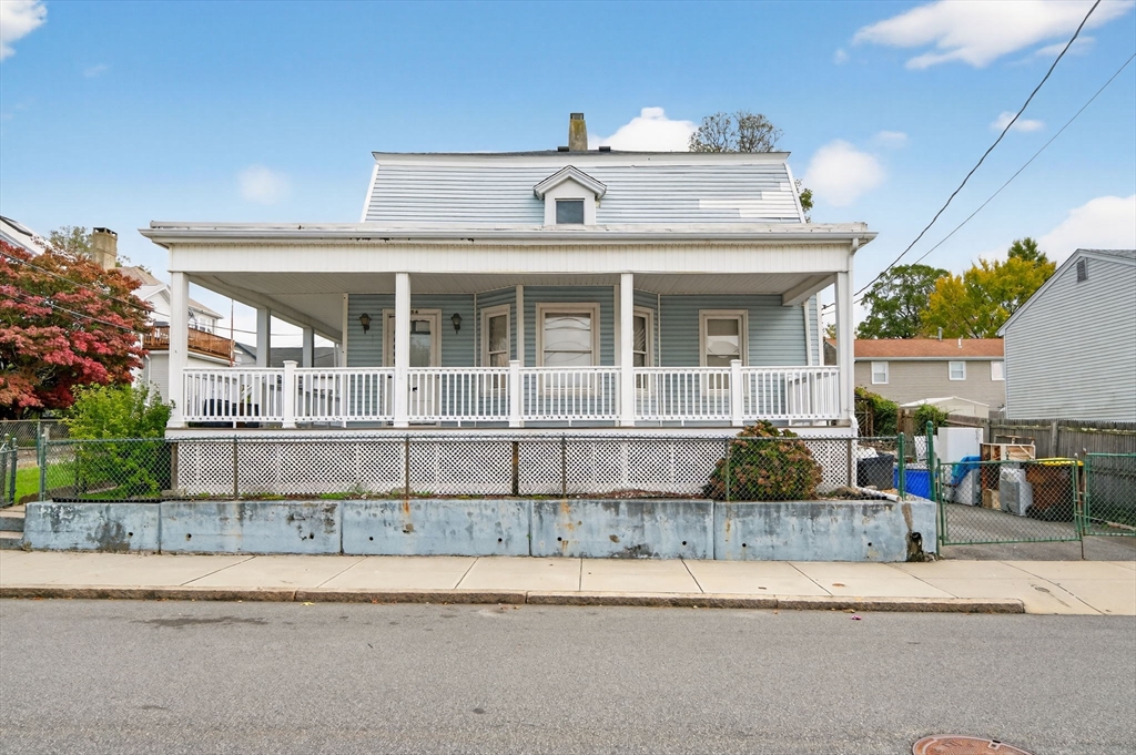 484 South Beach Street Fall River, MA 02724 - Photo 1 of 25 a front view of a house with a yard and potted plants