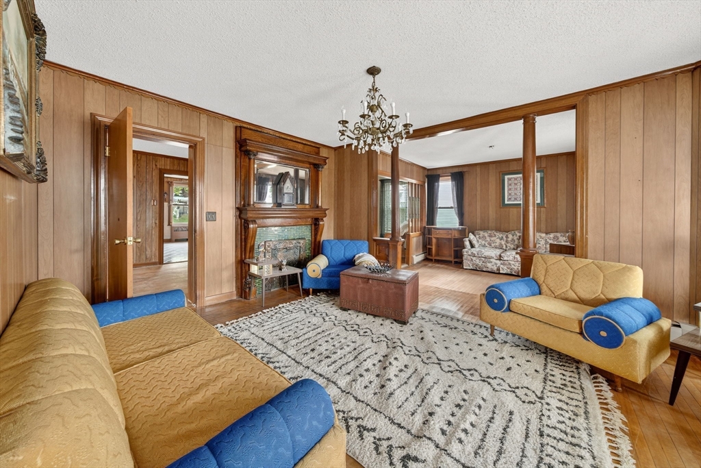 484 South Beach Street Fall River, MA 02724 - Photo 13 of 25 a living room with furniture wooden floor and a chandelier