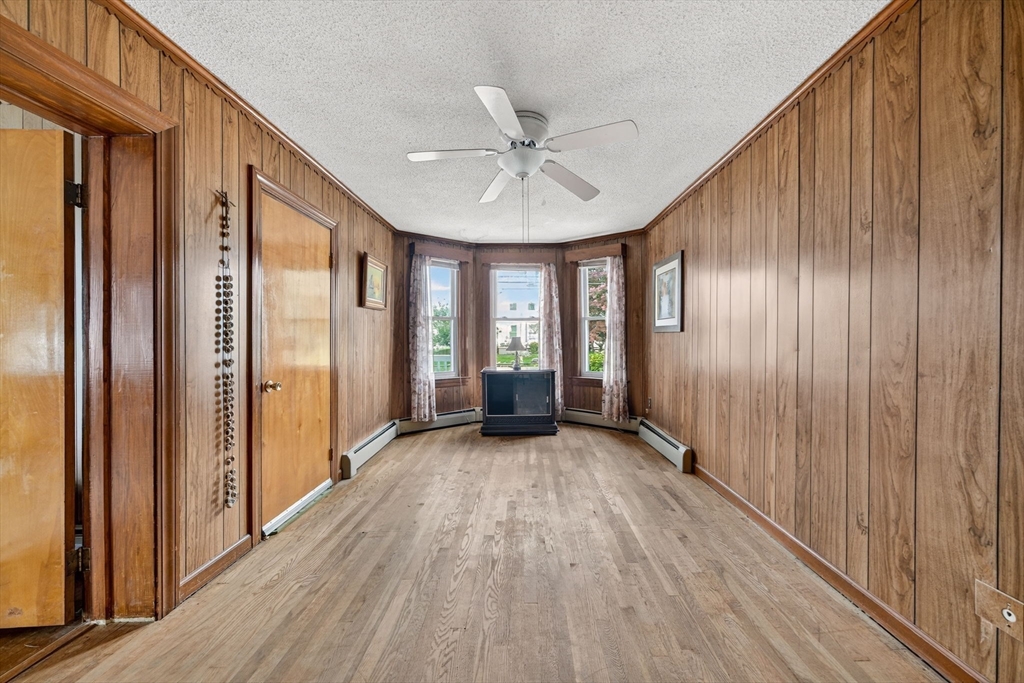 484 South Beach Street Fall River, MA 02724 - Photo 16 of 25 a view of a hallway with wooden floor and staircase