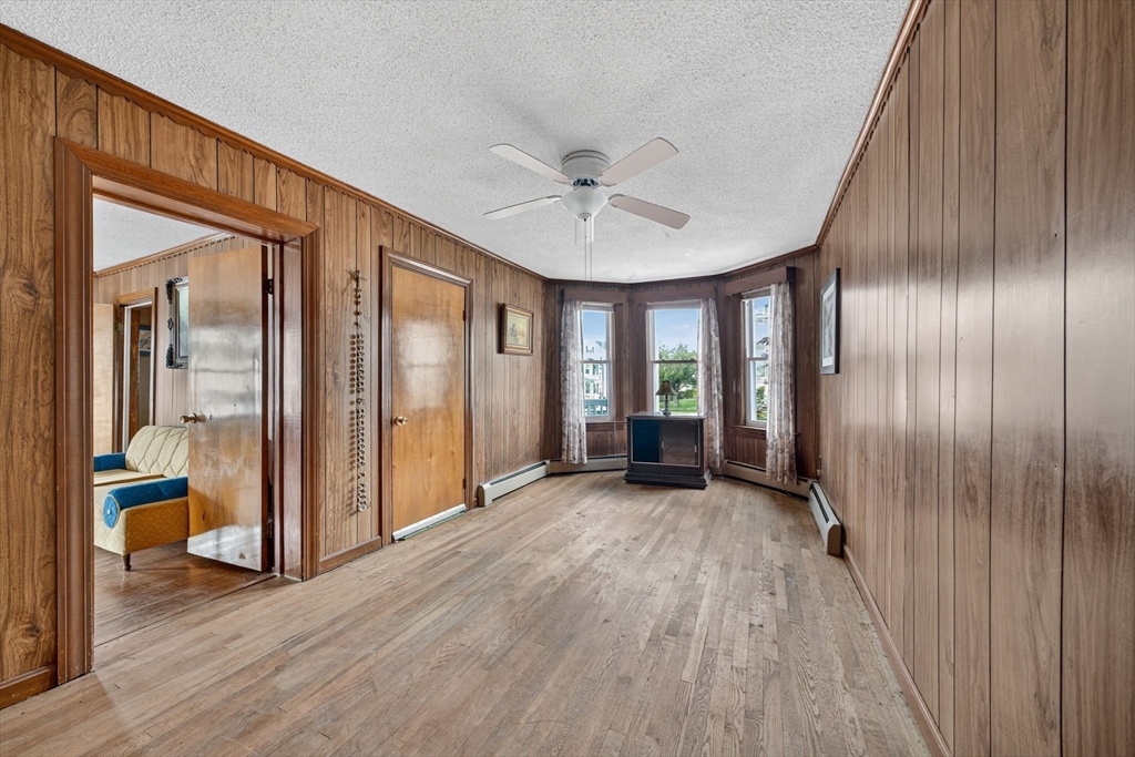 484 South Beach Street Fall River, MA 02724 - Photo 17 of 25 wooden floor in an empty room with a window