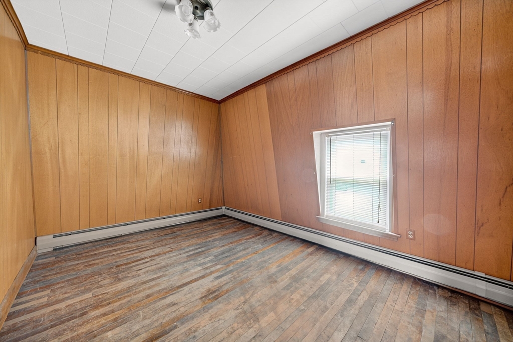 484 South Beach Street Fall River, MA 02724 - Photo 20 of 25 an empty room with wooden floor and windows