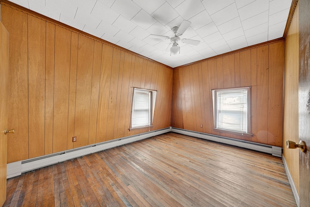 484 South Beach Street Fall River, MA 02724 - Photo 24 of 25 a view of an empty room with a window and wooden floor