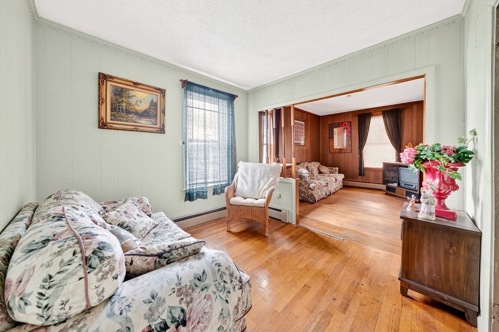 484 South Beach Street Fall River, MA 02724 - Photo 10 of 25 a bedroom with furniture and a large window