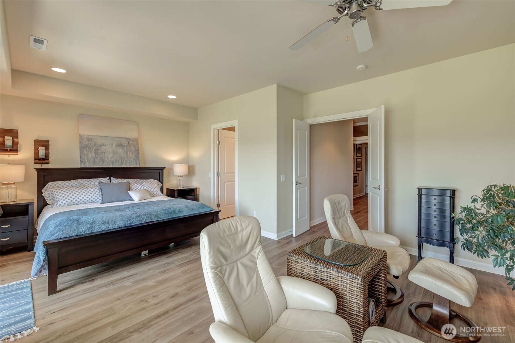 23318 Sunserra Loop, Unit B00 Quincy, WA 98848 - Photo 14 of 30 a bedroom with a bed and wooden floor