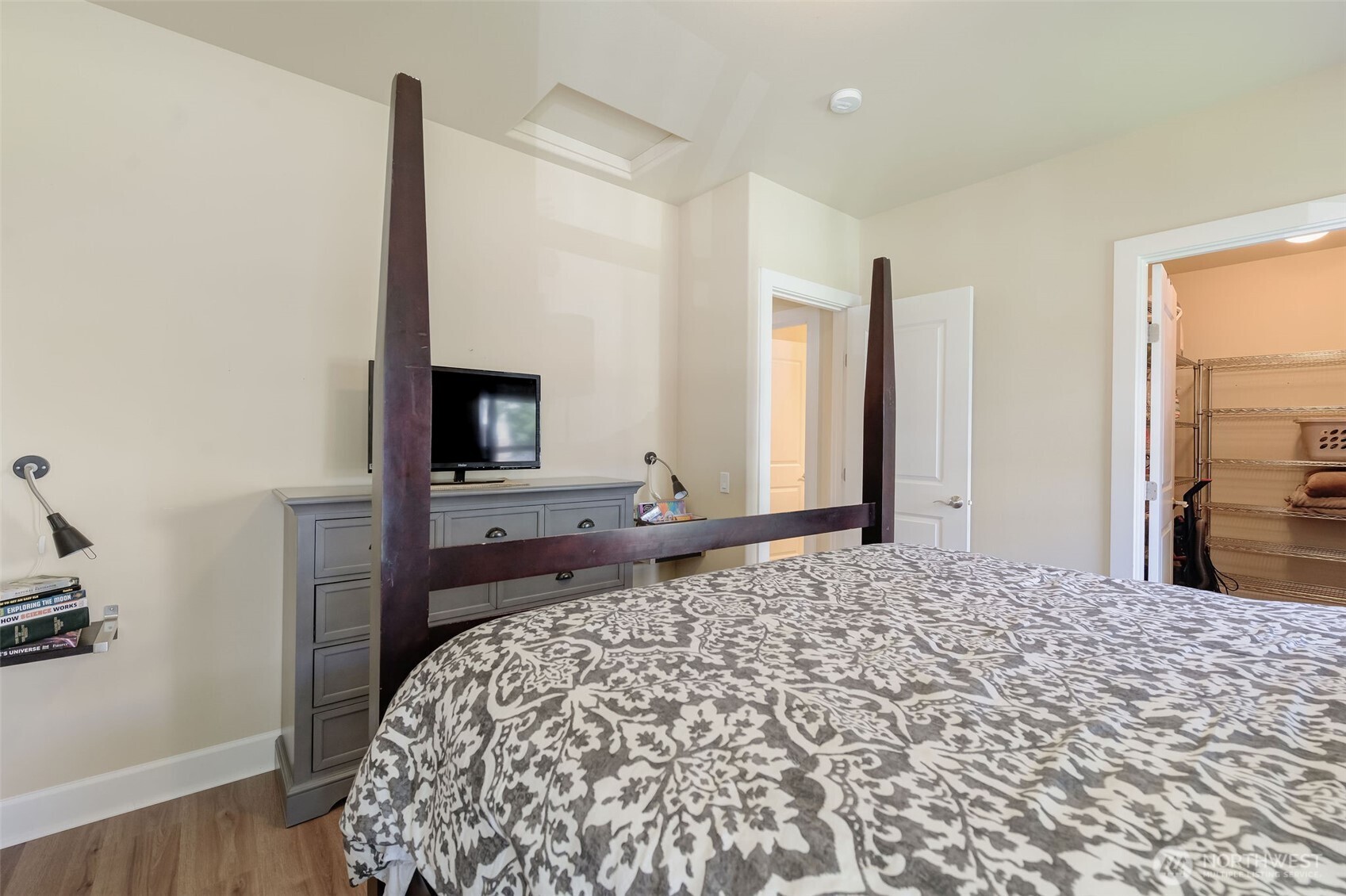 23318 Sunserra Loop, Unit B00 Quincy, WA 98848 - Photo 23 of 30 a bedroom with a bed and a flat screen tv