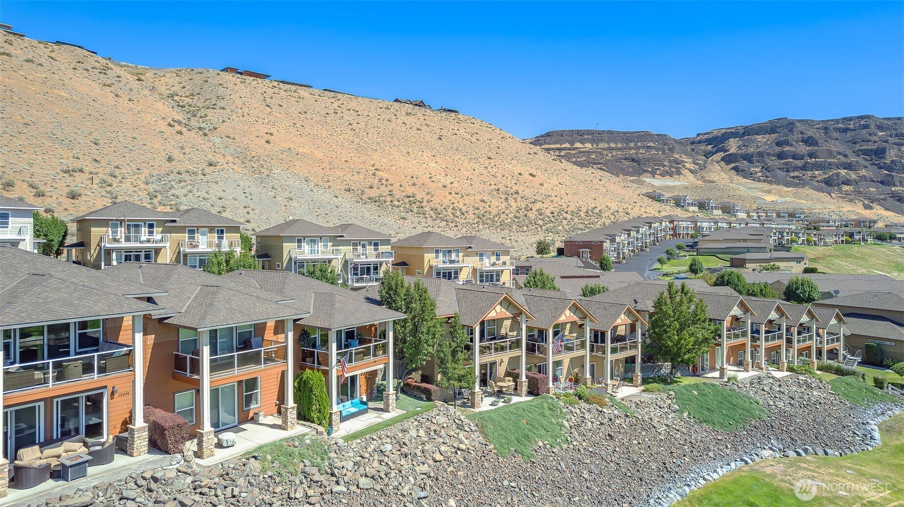 23318 Sunserra Loop, Unit B00 Quincy, WA 98848 - Photo 27 of 30 a view of a big house with a mountain in the background