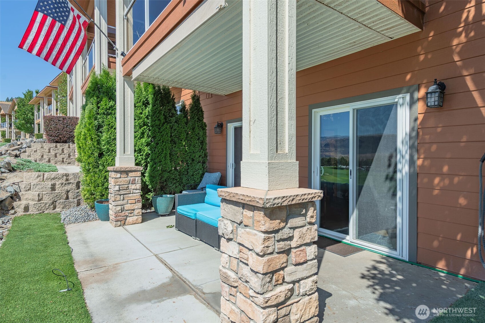 23318 Sunserra Loop, Unit B00 Quincy, WA 98848 - Photo 5 of 30 a view of a patio with table and chairs and potted plants