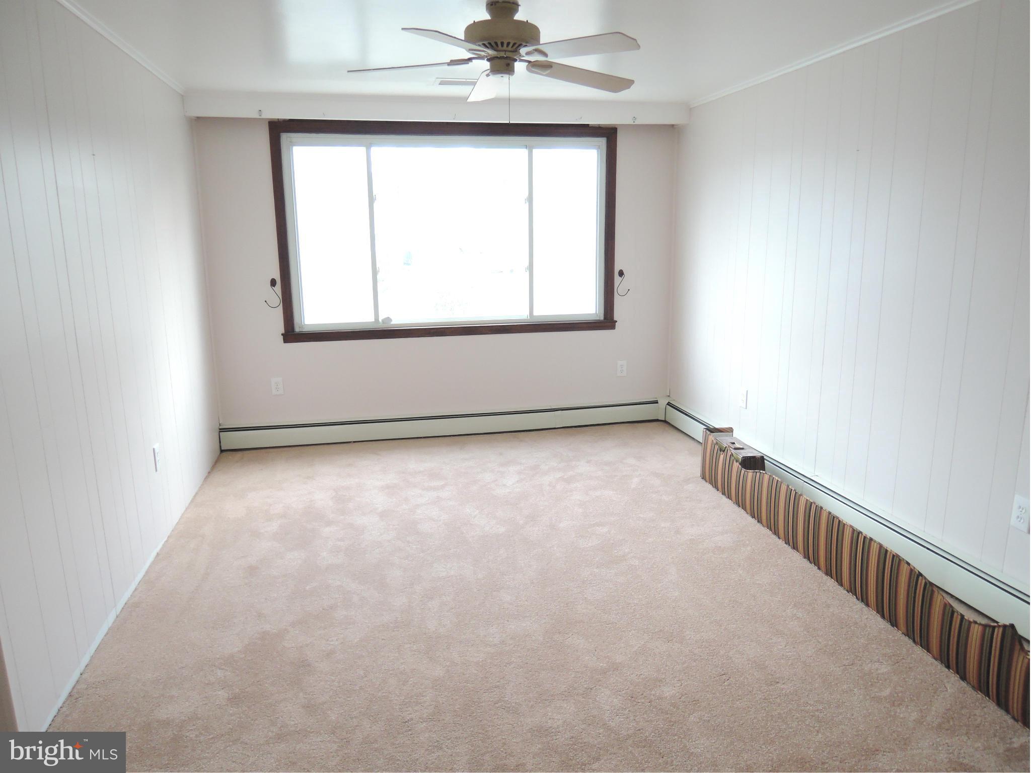 229 Arundel Road Pasadena, MD 21122 - Photo 12 of 23 Main level family room with new carpet