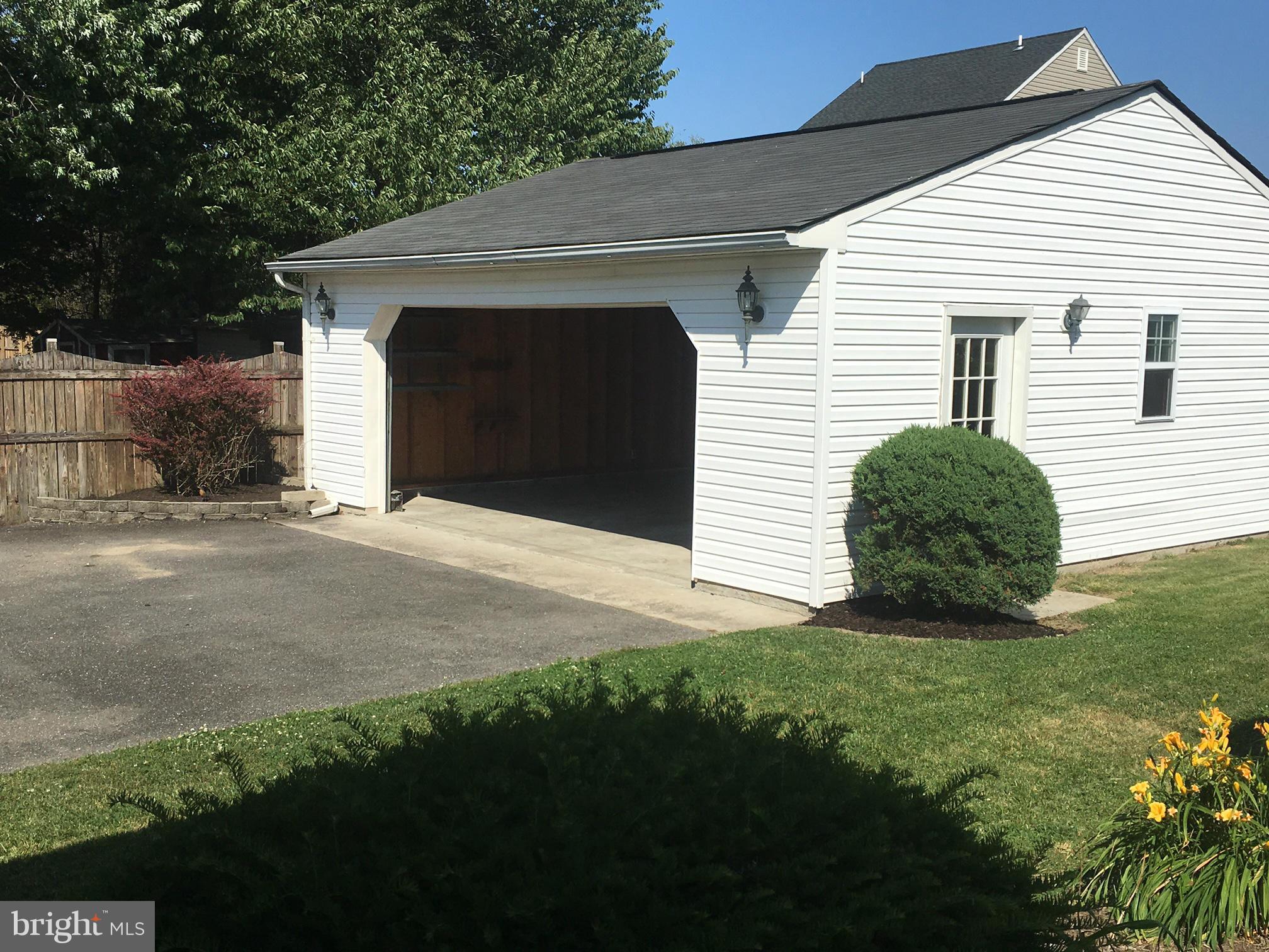 229 Arundel Road Pasadena, MD 21122 - Photo 20 of 23 Garage has built in shelves for extra storage