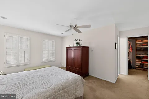 a bedroom with a bed and a table