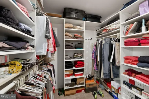 a big room with closet and windows