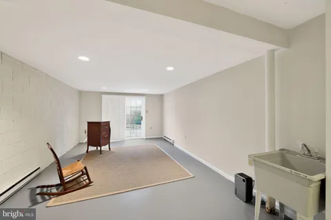 a view of a hallway with a ceiling fan
