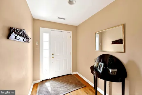 a view of entryway with wooden floor