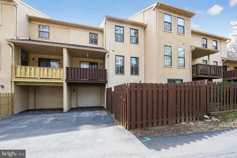 a view of backyard with seating space and trees