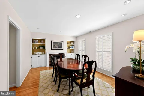 a view of a dining room with furniture and window