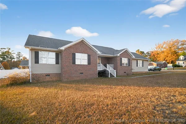 a front view of a house with a yard