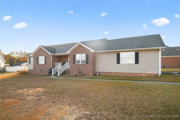 a front view of a house with a yard